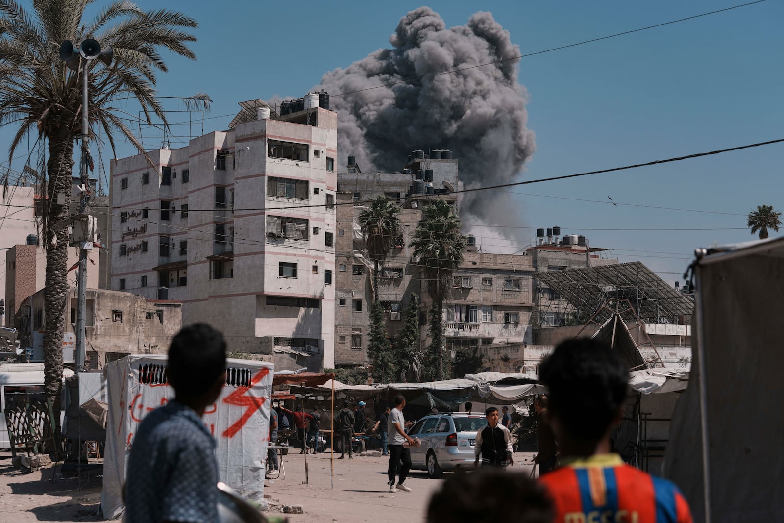 Smoke rises in the sky following an Israeli airstrike in Gaza City, Friday, May 30, 2025. (AP Photo/Jehad Alshrafi)