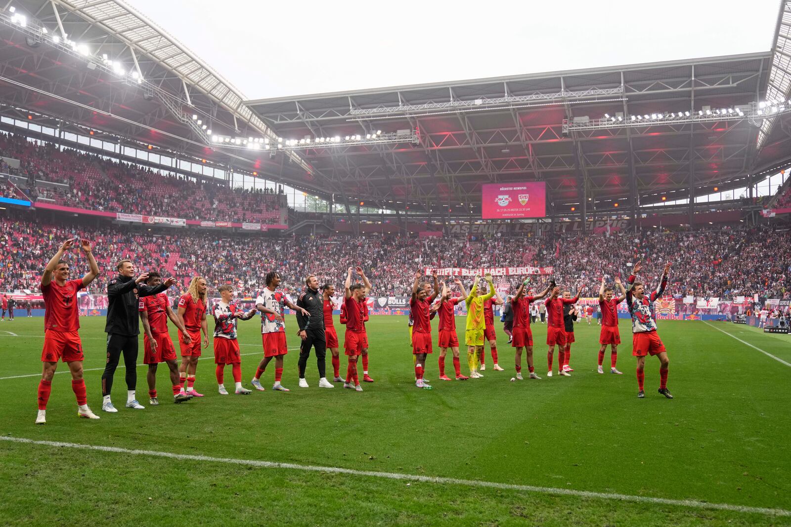 Bayern players thank the fans at the end of the German Bundesliga soccer match between RB Leipzig and FC Bayern Munich at the Red Bull Arena in Leipzig, Germany, Saturday, May 3, 2025. (AP Photo/Matthias Schrader)