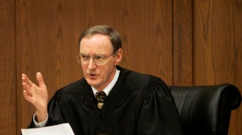 Judge Dennis Langer speaks to Charlie Myers about a letter he wrote to Langer while in prison during the sentencing procedures in court on Friday, Feb. 19. Myers, accused of shooting Jenny Nelson, a Harrison Twp. woman and kidnapping her 4-year-old son last year, pleaded guilty to all charges in exchange for a life without parole sentence.