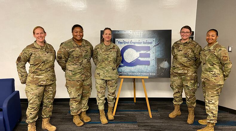 Col. Cheryl Deloughery, Capt. Danielle Tabb, Col. Laurie Richter, Capt. Devin DePalmer and Col. Shamekia Toliver pose for a photo on Oct. 29 following a panel discussion hosted by the Air Force Institute of Technology’s Civil Engineering School in which the colonels shared their experiences as women in the traditionally male-dominated civil engineer career field. U.S. AIR FORCE PHOTO/2ND LT. TIM ARCURI