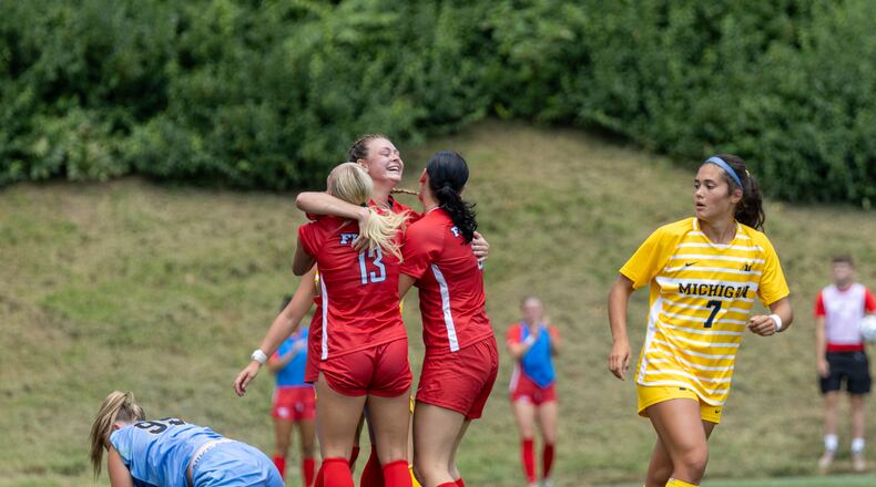Dayton players celebrate a goal during an exhibition game against Michigan on Sunday, Aug. 3, 2025, at Baujan Field. DAYTON ATHLETICS / CONTRIBUTED PHOTO