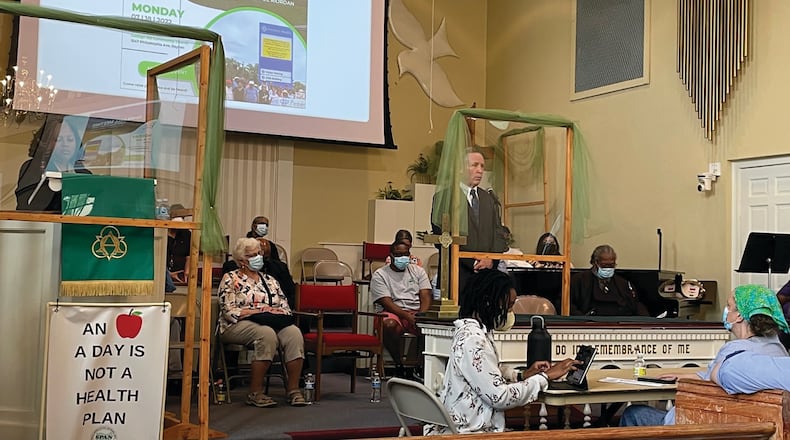 Premier Health CEO Michael Riordan addresses a town hall held Monday July 18, at the College Hill Church in Dayton and hosted by the Clergy Community Coalition. SAMANTHA WILDOW\STAFF