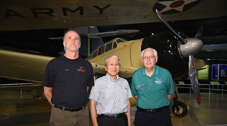 David Lazzarine, Dr. Keisuke Asai and Roger Deere pose in front of the remodeled Zero. (U.S. Air Force photo/Ken LaRock)