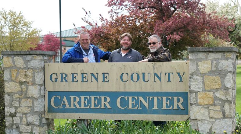 The former Greene County Career Center building will become a hub of activity again this fall. A group of tradesmen are working to turn the building into a trade school for those recovering from addiction. In the photo, from the left, stand owners Doug Van Dyke, Chris Adams and Kip Morris. CONTRIBUTED