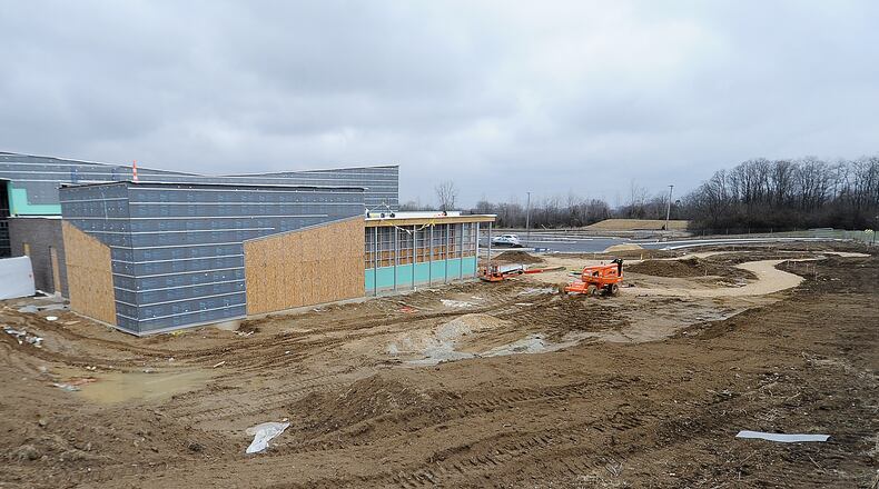 Construction of an $11.8 million branch of the Dayton Metro Library is ongoing in Huber Heights, related to a larger redevelopment of the former Marian Meadows shopping center near Brandt Pike and Fishburg Road. MARSHALL GORBY\STAFF