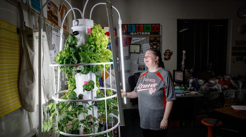 Westbrooke Village Elementary School STEM teacher Daniell Cossey stands next to the grow machine/tower in the classroom. Cossey is implementing agricultural education in her fifth grade classroom through the Green Bronx Machine program. JIM NOELKER/STAFF