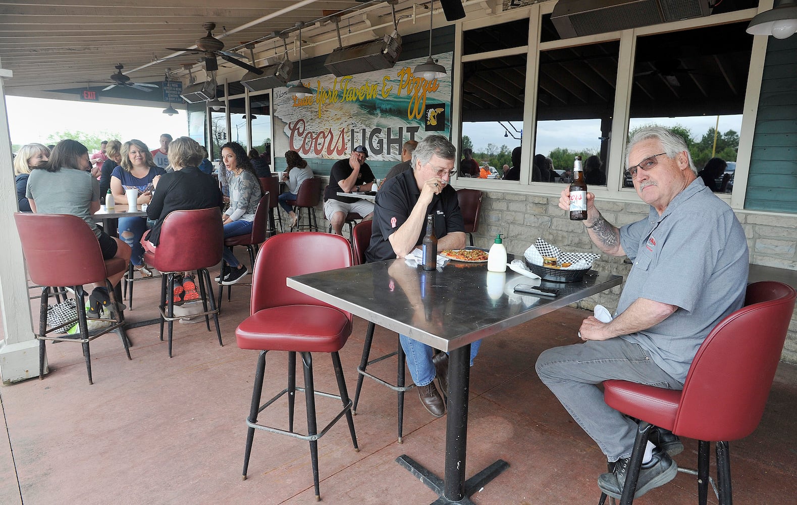 PHOTOS: Restaurants, salons reopen after coronavirus shutdowns