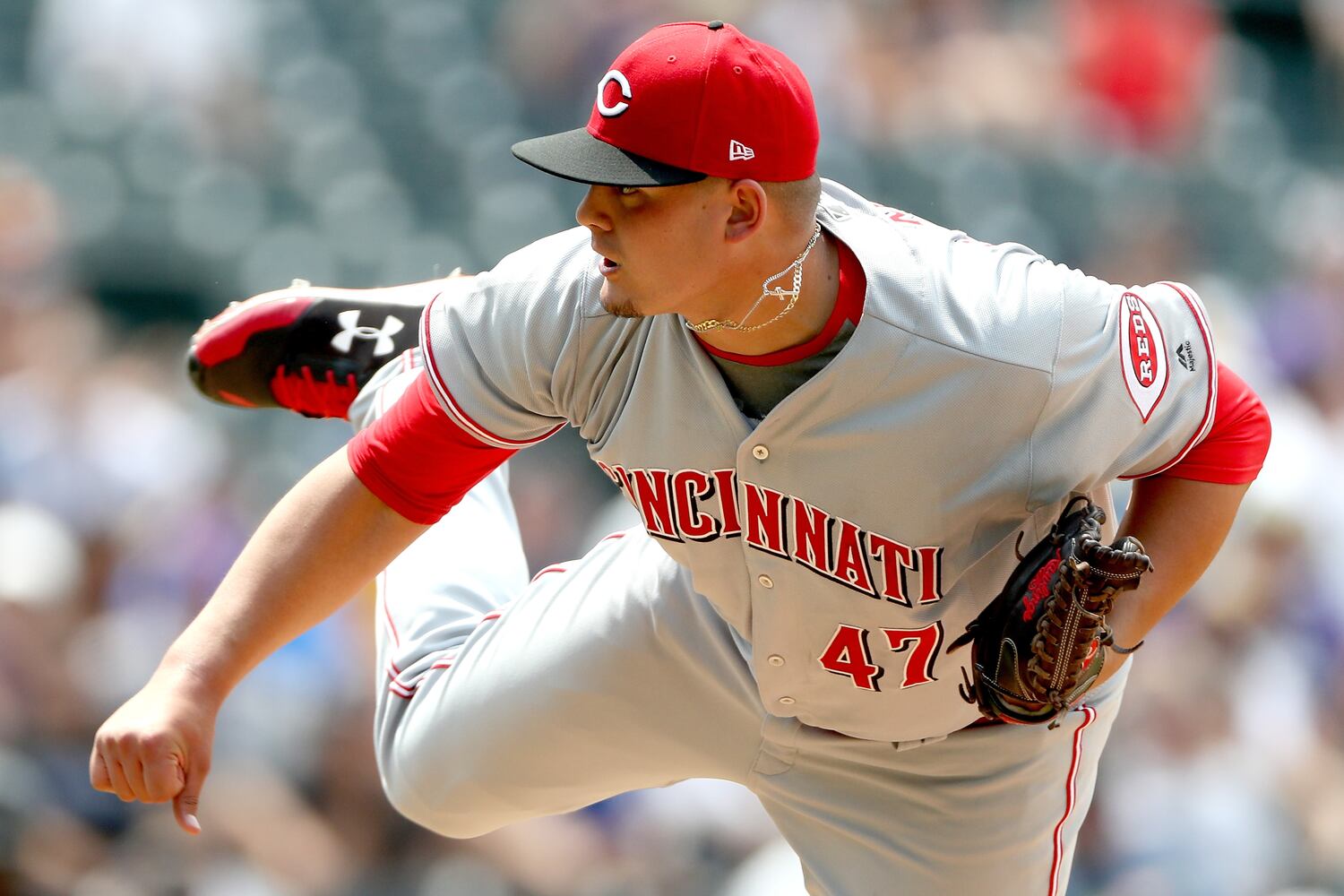 PHOTOS: Reds pile up 13 hits, beat the Rockies