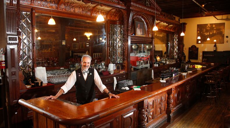 Jay’s Restaurant is scheduled to reopen its dining room this week, June 10, following more than two months after the coronavirus pandemic forced all Ohio restaurants to closing their dine-in service. Bob Moats has worked behind the historic bar at Jay's Restaurant in Dayton for more than three decades. The bar was originally hand-carved for the Pony House Restaurant in 1882. LISA POWELL / STAFF