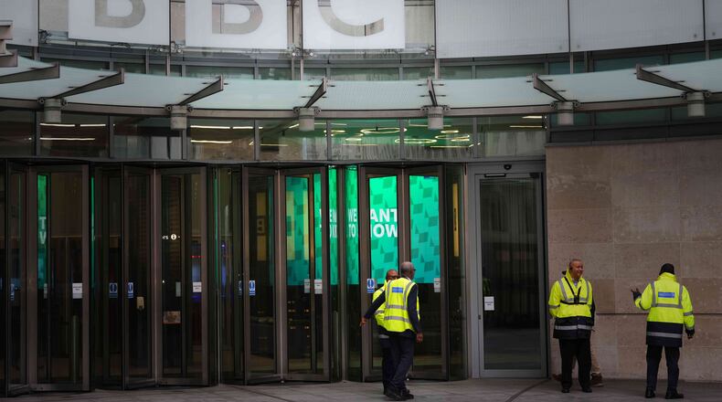 Security guards outside BBC Broadcasting House in London, Tuesday, Nov. 11, 2025. (AP Photo/Kirsty Wigglesworth)
