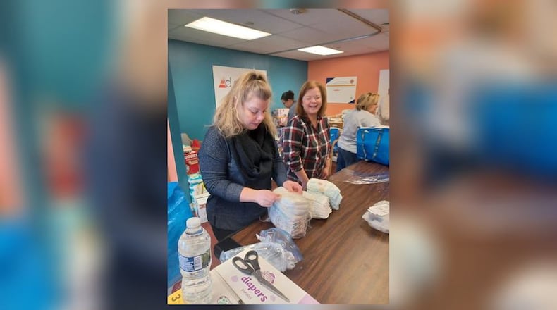 Dayton Diaper Depot volunteers provide diapers to families in need. CONTRIBUTED