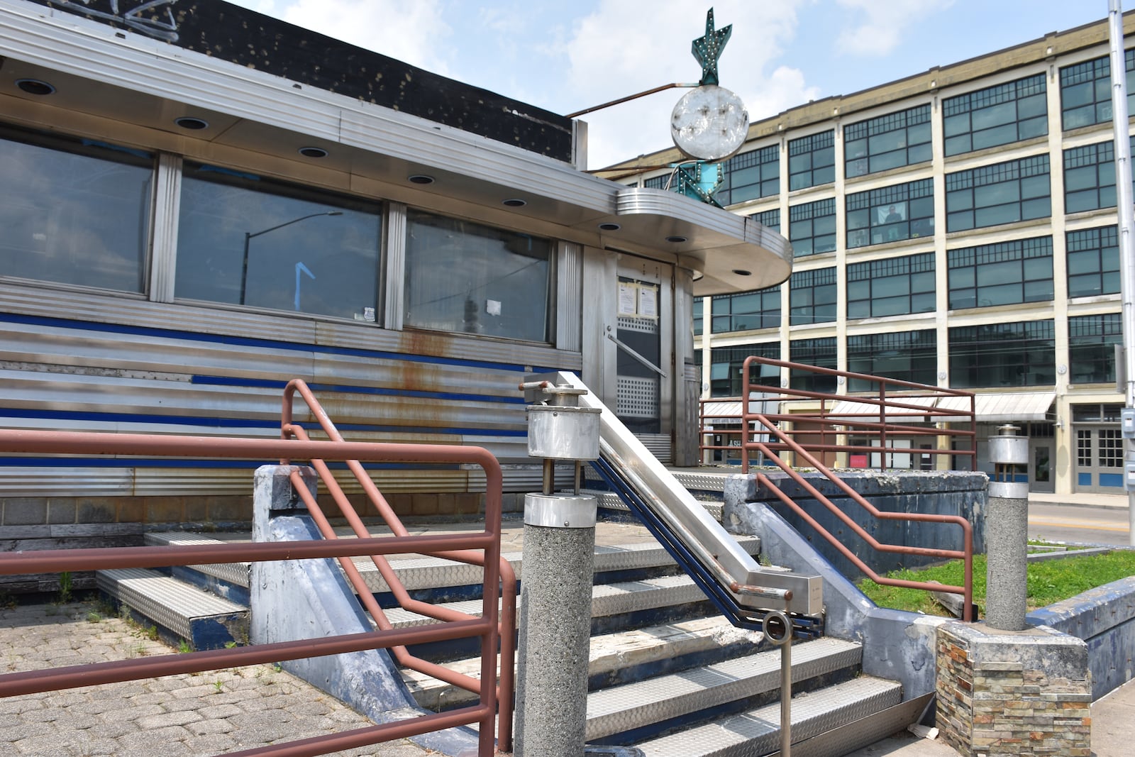 The city of Dayton in May 2025 purchased this former diner and night club at 101 S. St. Clair St. and an adjacent, vacant power station at 118 E. Fourth St. The city wants to build a new police station on these properties. CORNELIUS FROLIK / STAFF