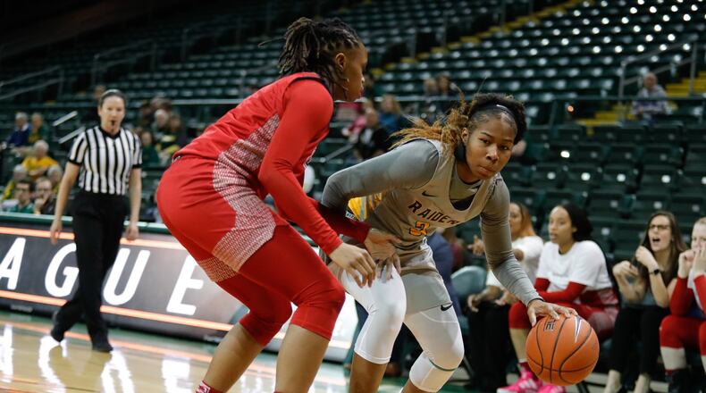 Wright State University’s Jana Roberson dribbles the ball while being defended by UIC’s Jealissa Presswood during their Horizon League Championship First Round game on Tuesday night at the Nutter Center. The Raiders won 83-47. CONTRIBUTED PHOTO BY MICHAEL COOPER