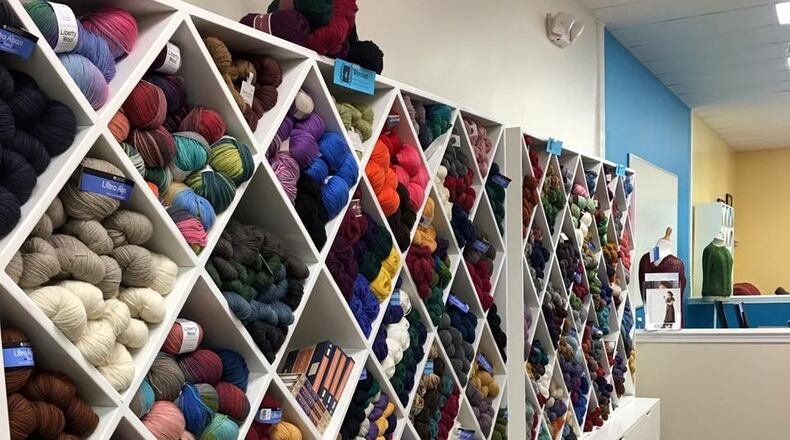 Triangular shelving holds various types of colorful yarns at Centerville Knit & Crochet. CONTRIBUTED