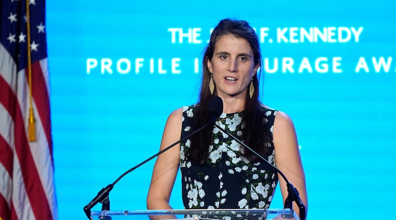 FILE - Tatiana Schlossberg, the daughter of Caroline Kennedy and Edwin Schlossberg, addresses an audience during the John F. Kennedy Profile in Courage Award ceremony, at the John F. Kennedy Presidential Library and Museum in Boston, Oct. 29, 2023. (AP Photo/Steven Senne, File)
