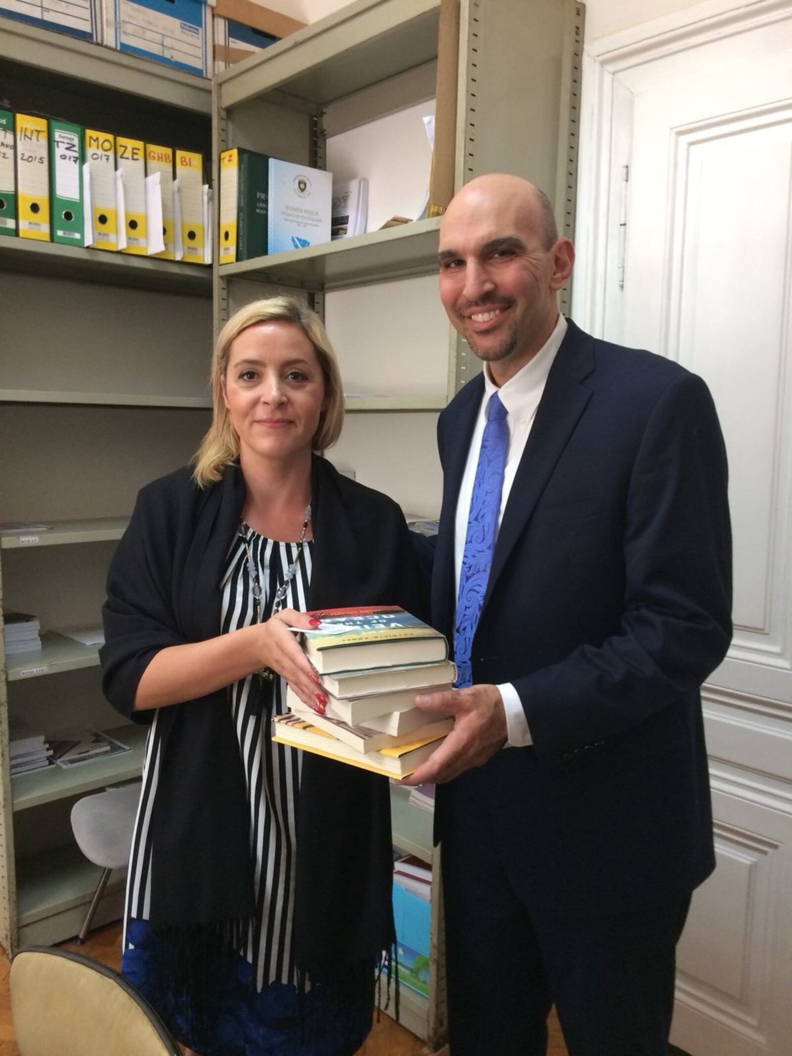 Dayton City Commissioner Matt Joseph delivers books to the Sarajevo library. CONTRIBUTED