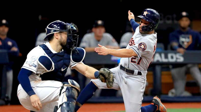 *** BESTPIX *** ST PETERSBURG, FLORIDA - OCTOBER 08:  Jose Altuve #27 of the Houston Astros is tagged out at home plate by Travis d'Arnaud #37 of the Tampa Bay Rays while attempting to score a run during the fourth inning in game four of the American League Division Series at Tropicana Field on October 08, 2019 in St Petersburg, Florida. (Photo by Mike Ehrmann/Getty Images)
