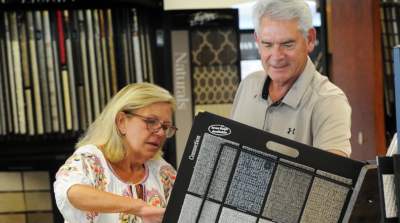 Bockrath Flooring and Rugs, Project Manager Tom Kenny talks with Lisa Briggs Monday, July 18, 2023. Kenny is celebrating his 50th year working at Bockrath Flooring and Rugs, located at 5557 Far Hills Ave. Dayton. MARSHALL GORBY\STAFF