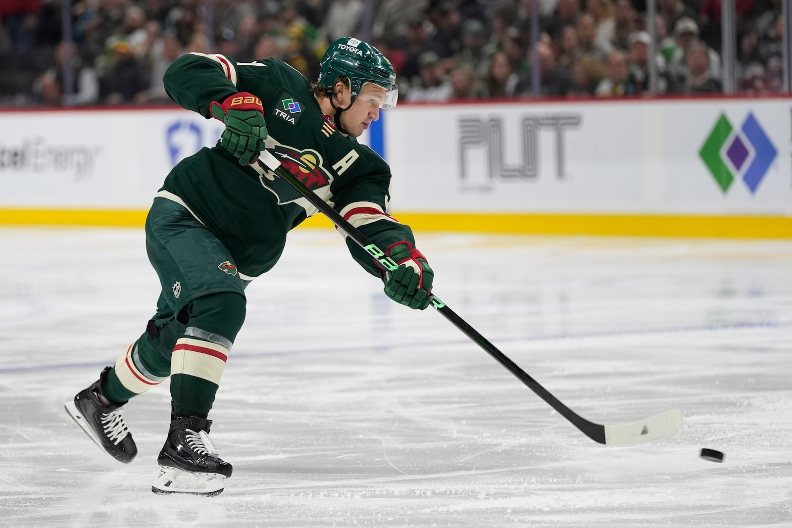 Minnesota Wild left wing Kirill Kaprizov (97) shoots the puck during the third period of an NHL hockey game against the San Jose Sharks, Wednesday, April 9, 2025, in St. Paul, Minn. (AP Photo/Abbie Parr)