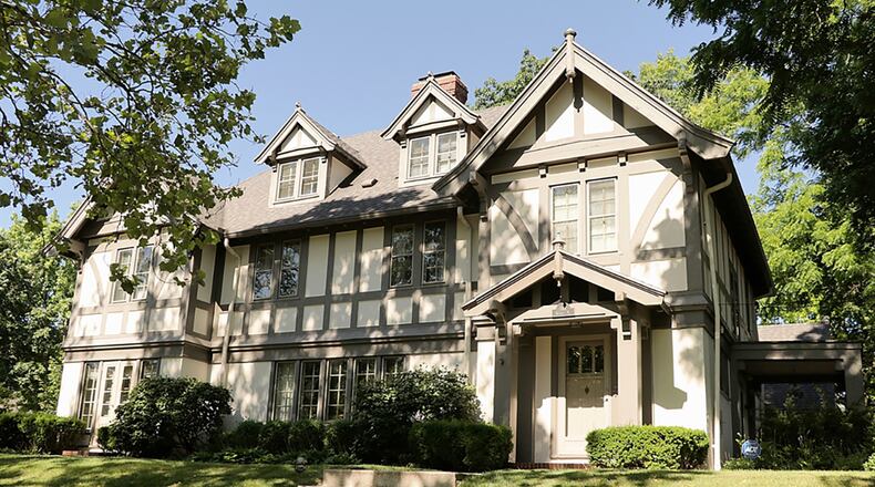 The Tudor-style home offers about 3,200 sq. ft. of living space and has a circular floor plan with a sun room, updated kitchen and office with the original built-in bookcases. There are 5 bedrooms and a finished third floor, which has 2 multipurpose rooms. CONTRIBUTED PHOTO BY KATHY TYLER