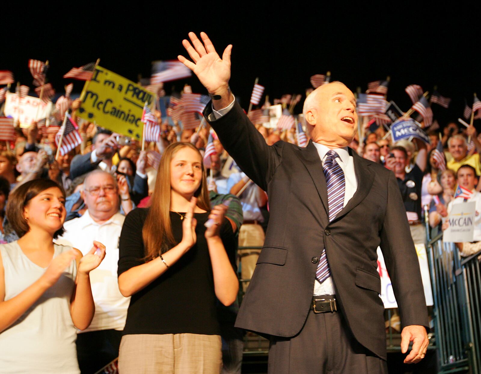 John McCain waves to the crowd as he takes the stage where he later introduced his vice presidential selection, Alaska Gov. Sarah Palin, on Friday, Aug. 29, 2008, at the Nutter Center in Fairborn, Ohio. Staff photo by Jim Witmer