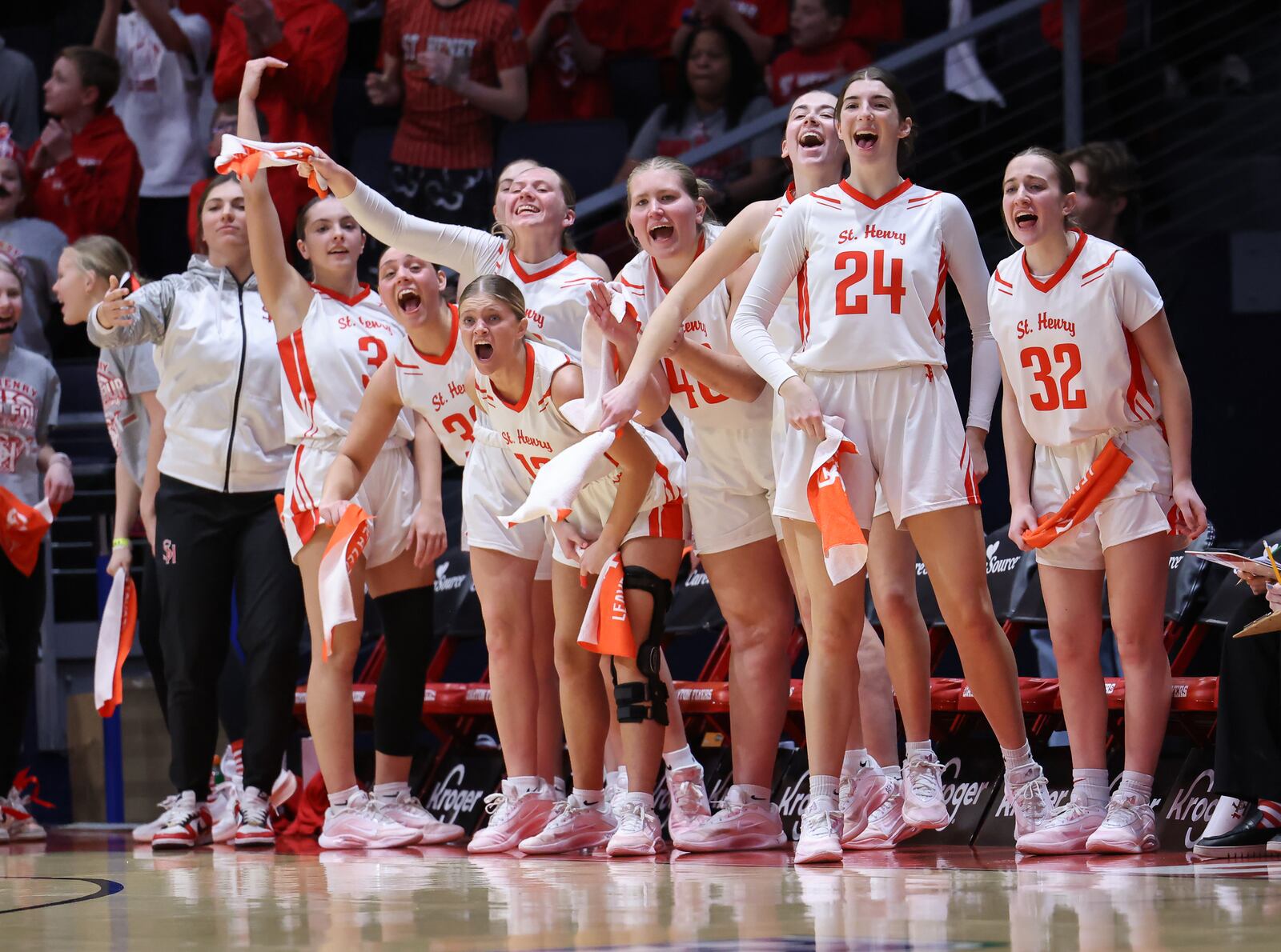 Players on St. Henry's bench celebrate after a basket in the first half of the Division VI state final on Friday, March 13 at University of Dayton Arena. BRYANT BILLING / STAFF