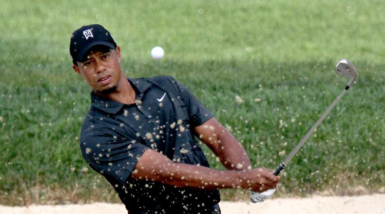 Tiger Woods practices on a bunker at Firestone Country Club in Akron, OH, Tuesday, August 2, 2011. Woods, coming off injuries and 11-weeks away from playing, is preparing for this week’s WGC-Bridgestone Invitational. (Marvin Fong / The Plain Dealer)