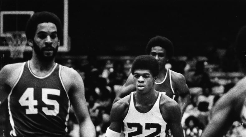 Dwight Anderson, #22, Roth HS, drives through traffic last against Dunbar back in 1978.