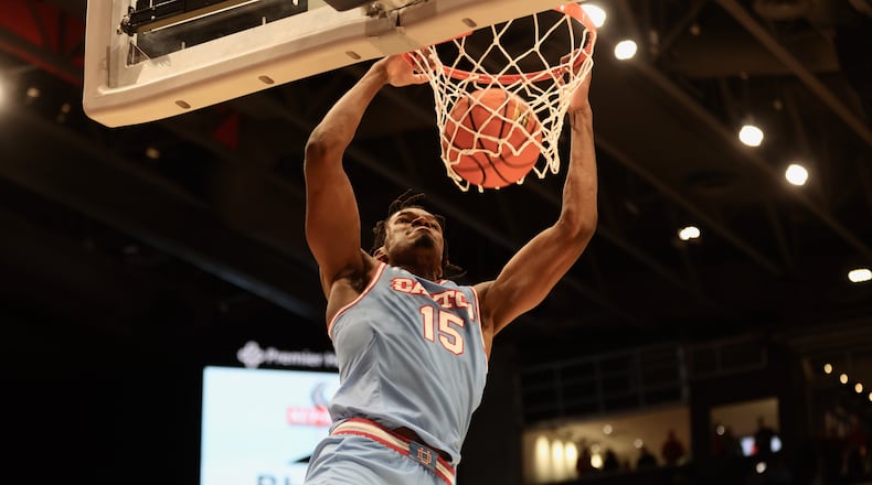 Dayton's DaRon Holmes II dunks against Southern Methodist on Friday, Nov. 11, 2022, at UD Arena. David Jablonski/Staff