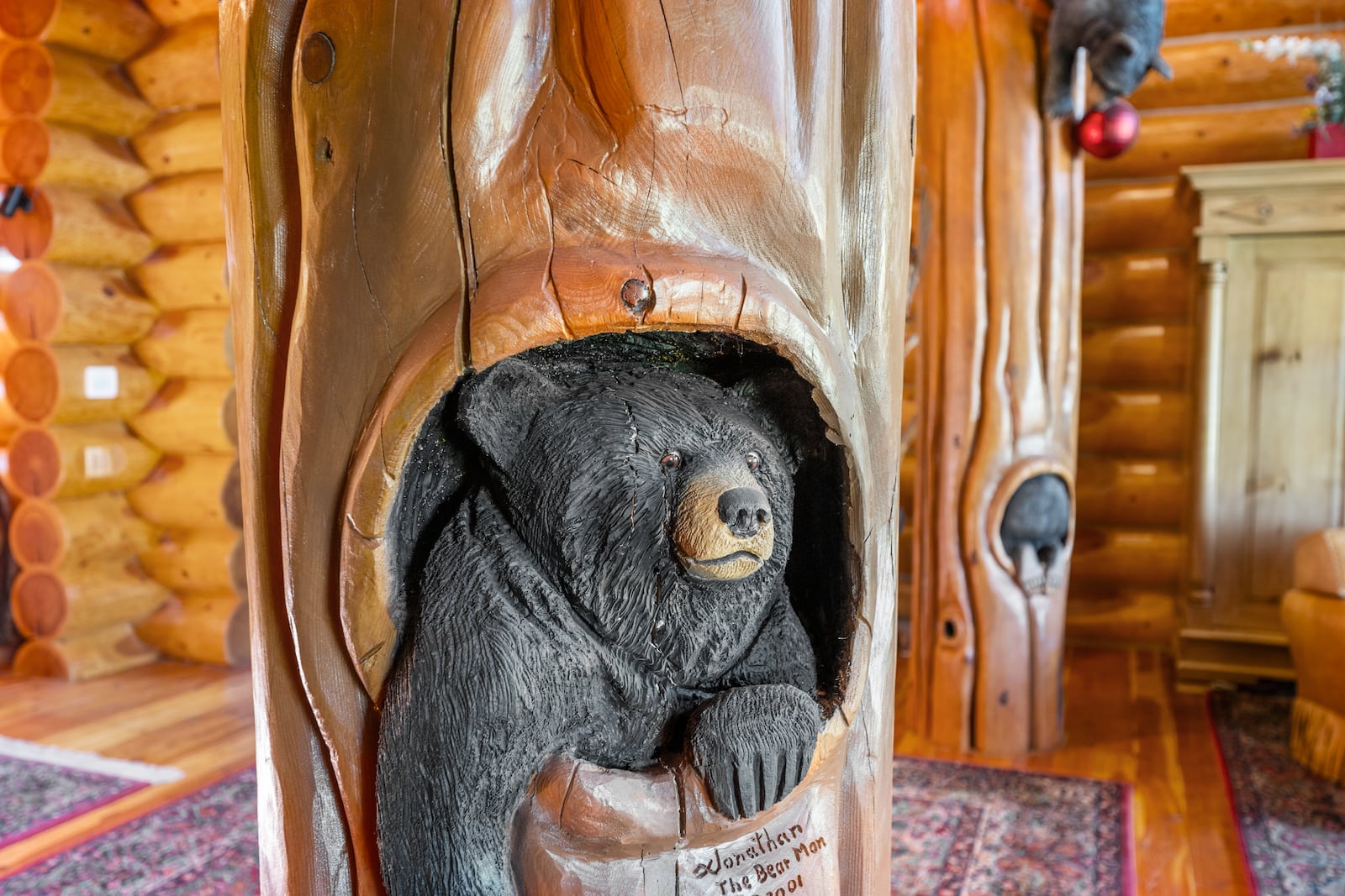 The 7,000-square-foot custom log home features 33 custom bear carvings by Wyoming artist Jonathan LaBenne, who spent six weeks completing the carvings inside and out at Saguaro Ranch outside Waynesville in Warren County. CONTRIBUTED