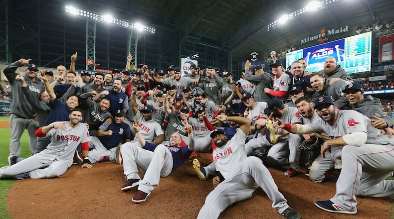 HOUSTON, TX - OCTOBER 18: The Boston Red Sox celebrate defeating the Houston Astros 4-1 in Game Five of the American League Championship Series to advance to the 2018 World Series at Minute Maid Park on October 18, 2018 in Houston, Texas. (Photo by Elsa/Getty Images)