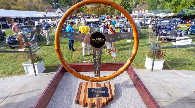 The R.H. Grant Best of Show Award sets the stage for the Dayton Concours d’Elegance at Carillon Park. The wood steering wheel trophy is handmade by local artist/craftsman Paul Rich; each year’s model is unique. Photo by Doug Lewis/Lewis Digital Imaging