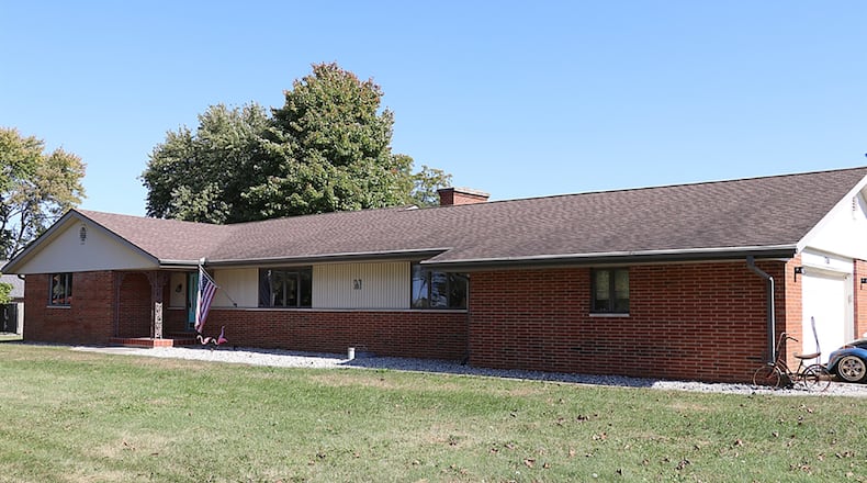 The brick-and-vinyl ranch with 4 bedrooms has about 2,590 sq. ft. of living space. The house sits off the main road with a gravel side road entrance to the concrete driveway. CONTRIBUTED PHOTO BY KATHY TYLER