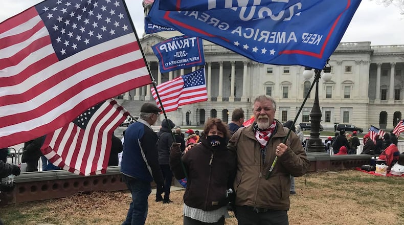 Miamisburg residents Rhonda and Greg Dulin pose for a photo outside the U.S. Capitol in Washington D.C. around 11 a.m. Wednesday, Jan. 6, 2021, before the scene devolved into chaos. Greg Dulin said the actions of those who did so  took things "way too far." CONTRIBUTED