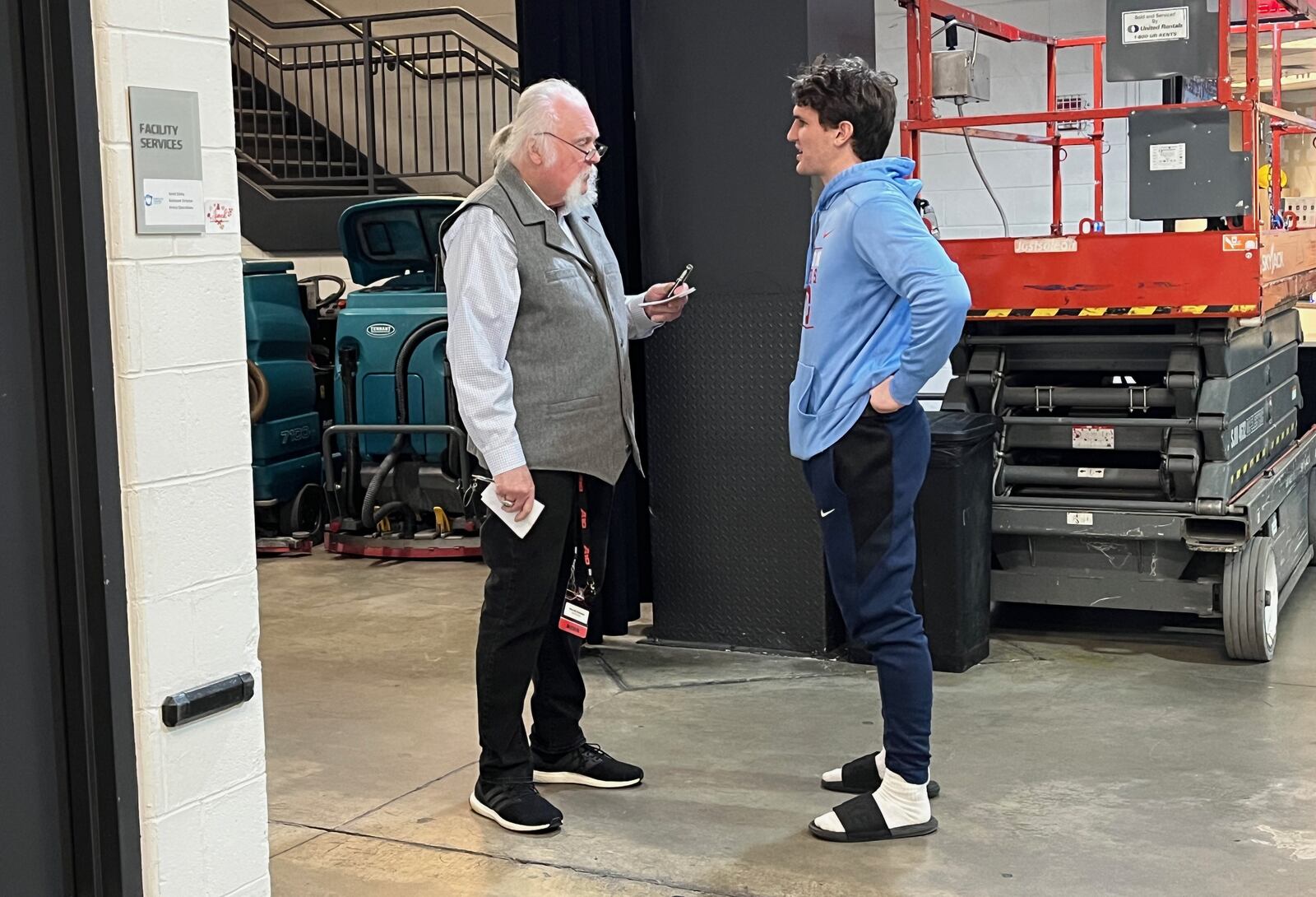 Dayton Daily News columnist Tom Archdeacon interviews Brady Uhl after a game against Saint Joseph’s in the quarterfinals of the Atlantic 10 Conference tournament on Thursday, March 9, 2023, at the Barclays Center in Brooklyn, N.Y. David Jablonski/Staff