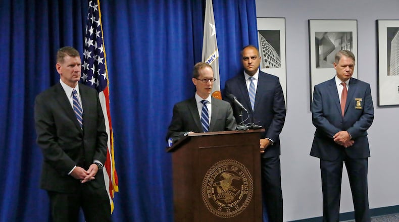U.S. Attorney Benjamin Glassman, photographed at the podium, talks in August about the arrest of Ethan Kollie, a friend of Oregon District mass shooter Conner Betts. With Glassman from the left are Todd Wickerham, special agent in charge, FBI; Vipal Patel, first assistant U.S. attorney; and Dayton Police Chief Richard Biehl. TY GREENLEES / STAFF