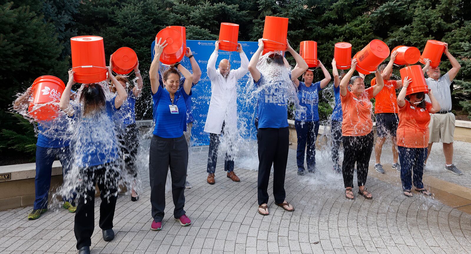 Officials with Premier Health and ALS United Ohio commemorate the 10th anniversary of the viral Ice Bucket Challenge with a special event at Miami Valley Hospital South Friday, Sept. 20, 2024 . The celebration marked the grand opening of a new Multidisciplinary ALS Clinic at the Clinical Neuroscience Institute, which is scheduled to see its first patients in October. MARSHALL GORBY/STAFF