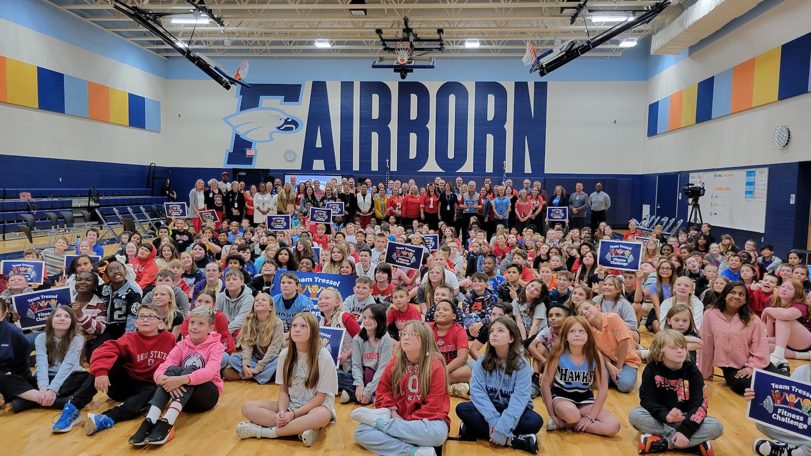 Fairborn Intermediate School students, with teachers, administrators and lawmakers in the back, pose for a photo during Lt. Gov. Jim Tressel's visit, Aug. 27, 2025. LONDON BISHOP/STAFF