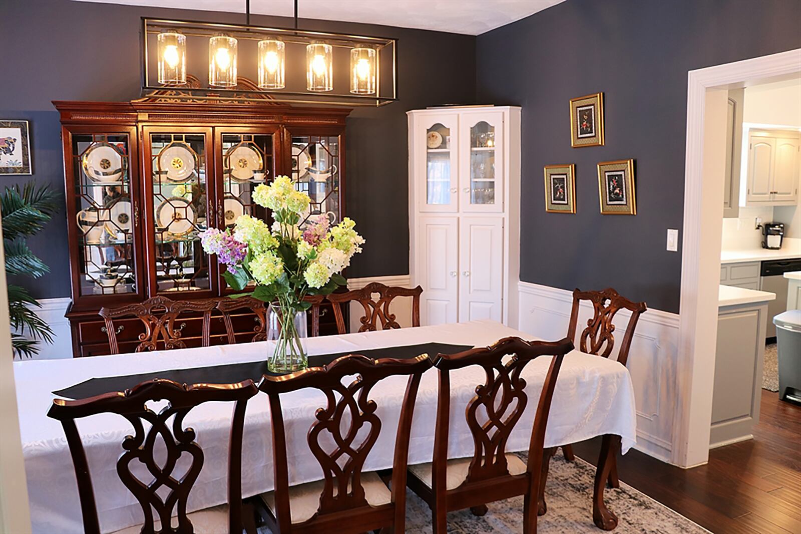 Off the kitchen and accessible from the great room is the formal dining room. The dining room has two built-in corner china cabinets with glass-panel doors. CONTRIBUTED PHOTO BY KATHY TYLER