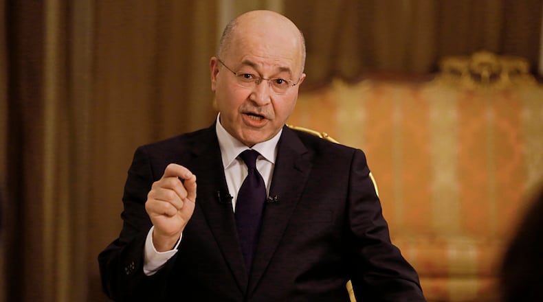 FILE - Iraq's President Barham Salih speaks during an interview with The Associated Press in Baghdad, Iraq, Friday, March 29, 2019. (AP Photo/Khalid Mohammed, File )