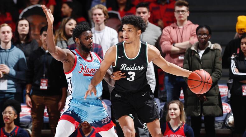 Wright State’s Mark Hughes looks to make a pass against UIC on Friday night. Steve Woltmann/CONTRIBUTED