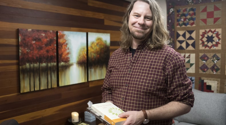 Psychologist Russell Kolts, who is also a professor at Eastern Washington University, in his Spokane, Wash. office with a couple of his more popular books, including “Managing Your Anger” and “An Open-Hearted Life.” (Jesse Tinsley/The Spokesman-Review/TNS)