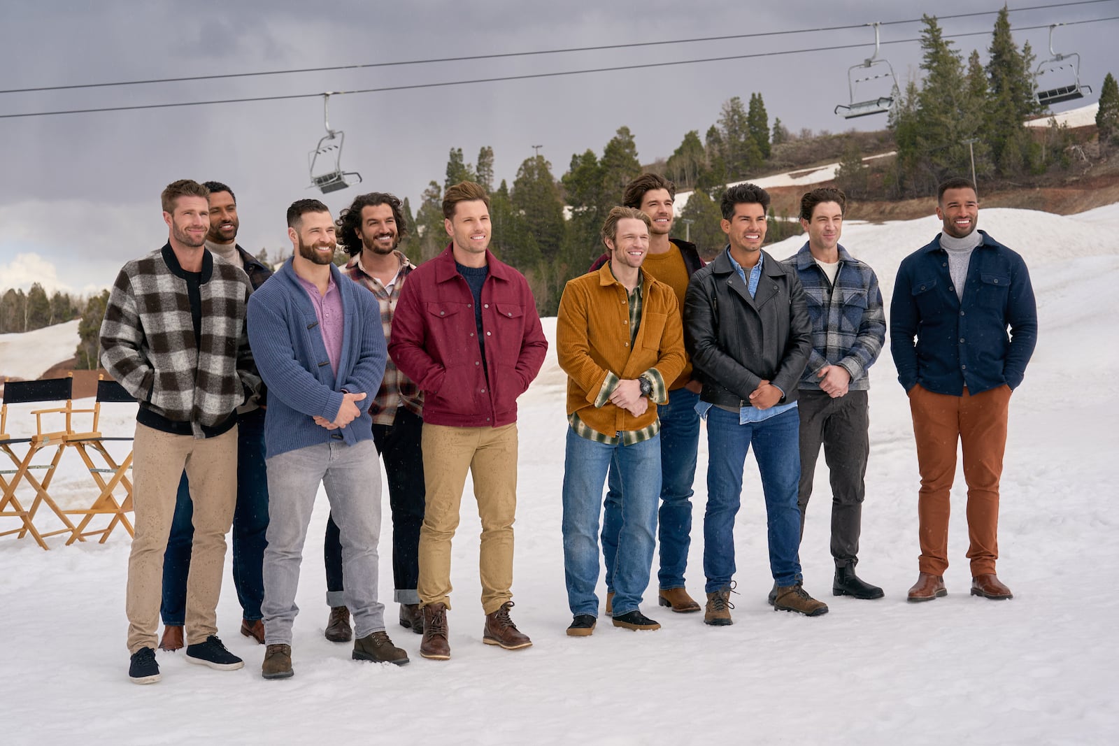 Host Jonathan Bennett and judge Melissa Peterman kick off the hunt for Hallmark’s next leading man as 10 new hunks reinvent Santa, then brave a ski-slope meet-cute with Janel Parrish- where spills steal the scene.  Photo left to right): Davey Fisher, Gabriel Thaxton, Jake Schum, Rustin Sailors, Craig Geoghan, Logan Shephard (center), Drake Kuyper, Angel Garet, Robbie Simpson, Marcus Brodie  Credit: ©2025 Hallmark Media/Photographer: Kim Nunneley