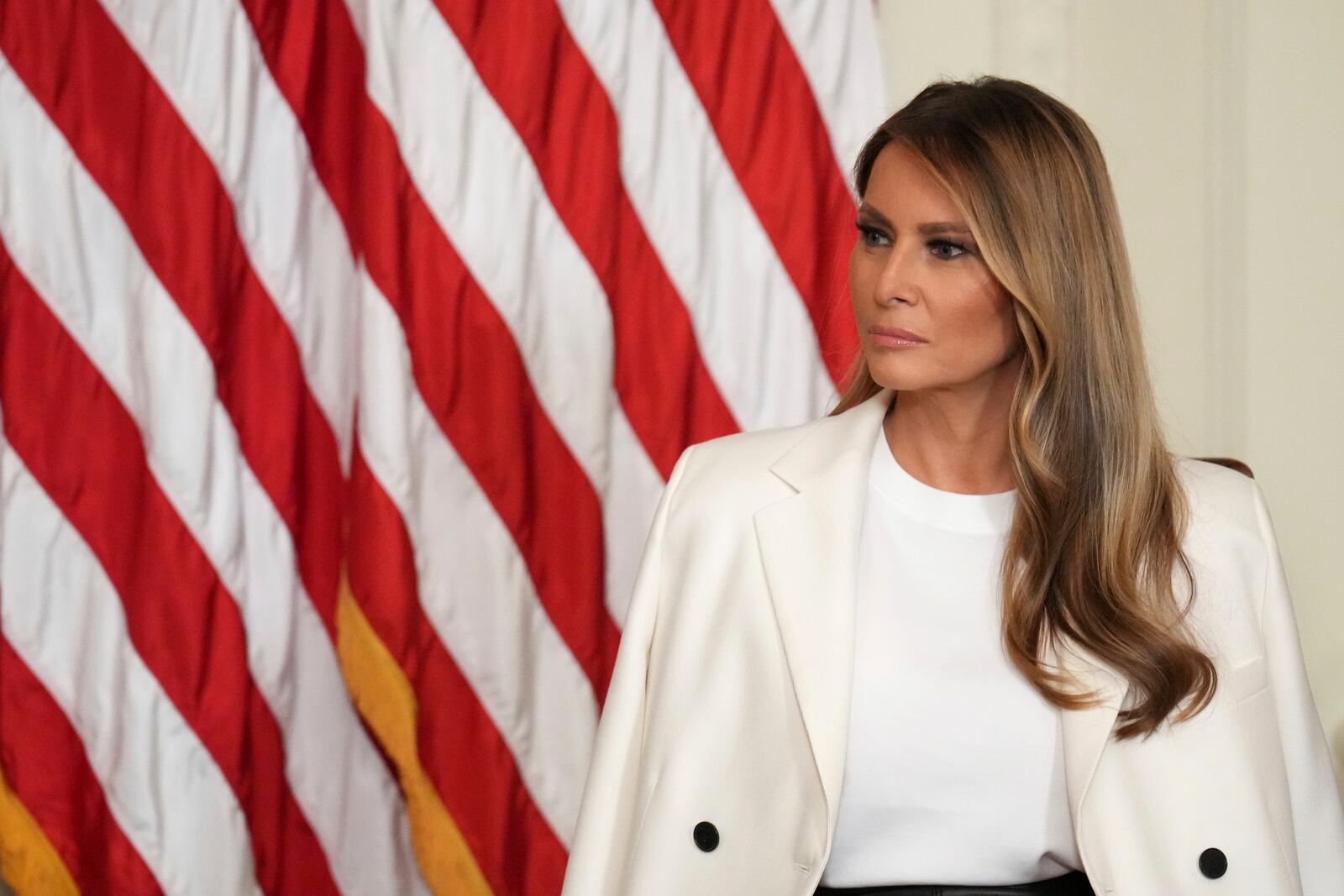 FILE - First lady Melania Trump attends an event unveiling a U.S. Postal Service Stamp honoring former first lady Barbara Bush, May 8, 2025, in the East Room of the White House in Washington. (AP Photo/Jacquelyn Martin, File)