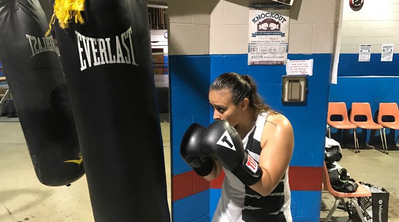 U.S. Air Force Airman 1st Class Jasmine Aldana, a former college soccer standout stationed at WPAFB, works out in Drake’s Downton Gym one night this week. She s fighting in one of the featured bouts Saturday night at the big Ale Beast charity boxing show outside Drake’s gym on E. Fifth Street next to the Oregon District. Tom Archdeacon/CONTRIBUTED