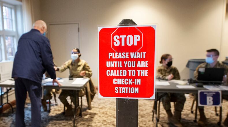 Airmen of the 88th Medical Group operate a vaccination center Jan. 27 in the Wright-Patterson Club. Patients got help with paperwork, were checked in, received their shots and had space to sit for 15 minutes to make sure they did not suffer any serious side effects. U.S. AIR FORCE PHOTO/R.J. ORIEZ