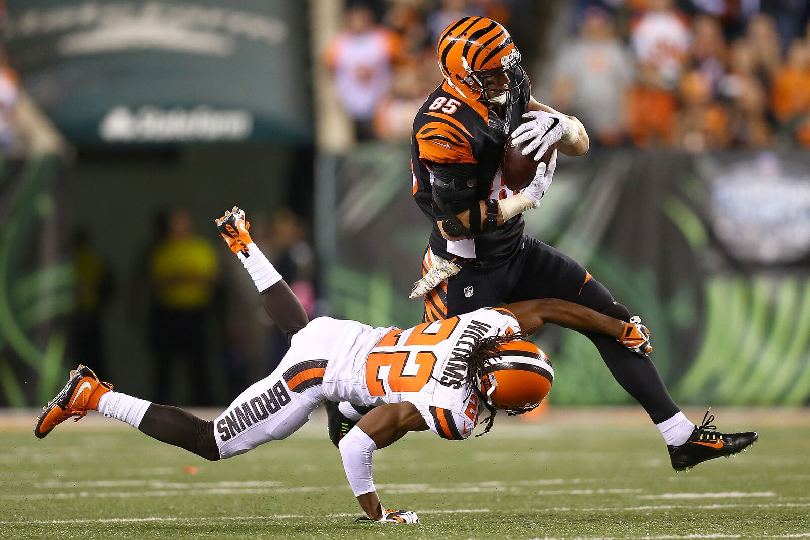 CINCINNATI, OH - NOVEMBER 5: Tramon Williams #22 of the Cleveland Browns attempts to tackle Tyler Eifert #85 of the Cincinnati Bengals during the fourth quarter at Paul Brown Stadium on November 5, 2015 in Cincinnati, Ohio. Cincinnati defeated Cleveland 31-10.(Photo by Andrew Weber/Getty Images)
