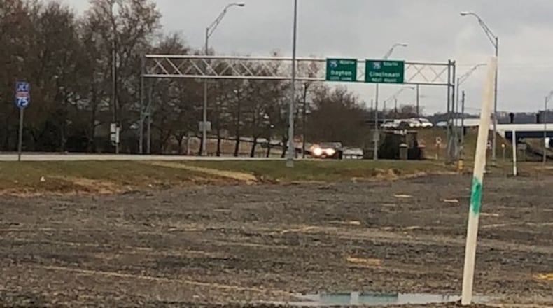 The former Carrollton Plaza property on East Dixie Drive near Interstate 75 in West Carrollton has been cleared. The city is working to transfer the site to the Montgomery County Landbank program while it shops for a developer. NICK BLIZZARD/STAFF