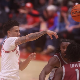 Dayton's Javon Bennett passes against North Carolina Central on Saturday, Nov. 22, 2025, at UD Arena. David Jablonski/Staff