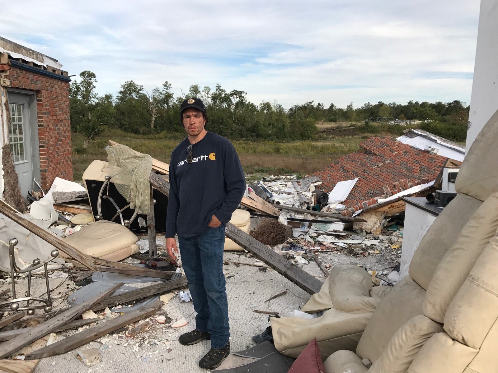 Derek Felds at the house he shared with his parents on the old Moss Creek Golf Club in Trotwood. The home was destroyed by a Memorial Day tornado and is slated for demolition. Tom Archdeacon/CONTRIBUTED